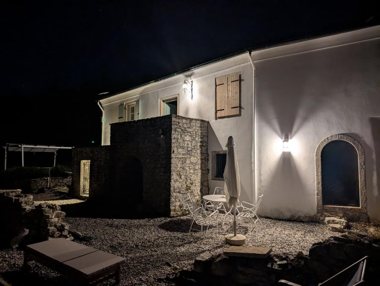Exterior view of the stone house and courtyard at The Notaries' House